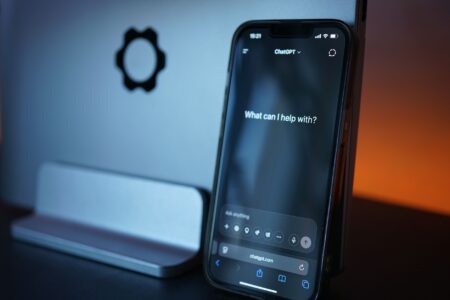 Claude vs. ChatGPT: One AI Falls Short on Quality A person typing into an AI chat assistant on a laptop screen