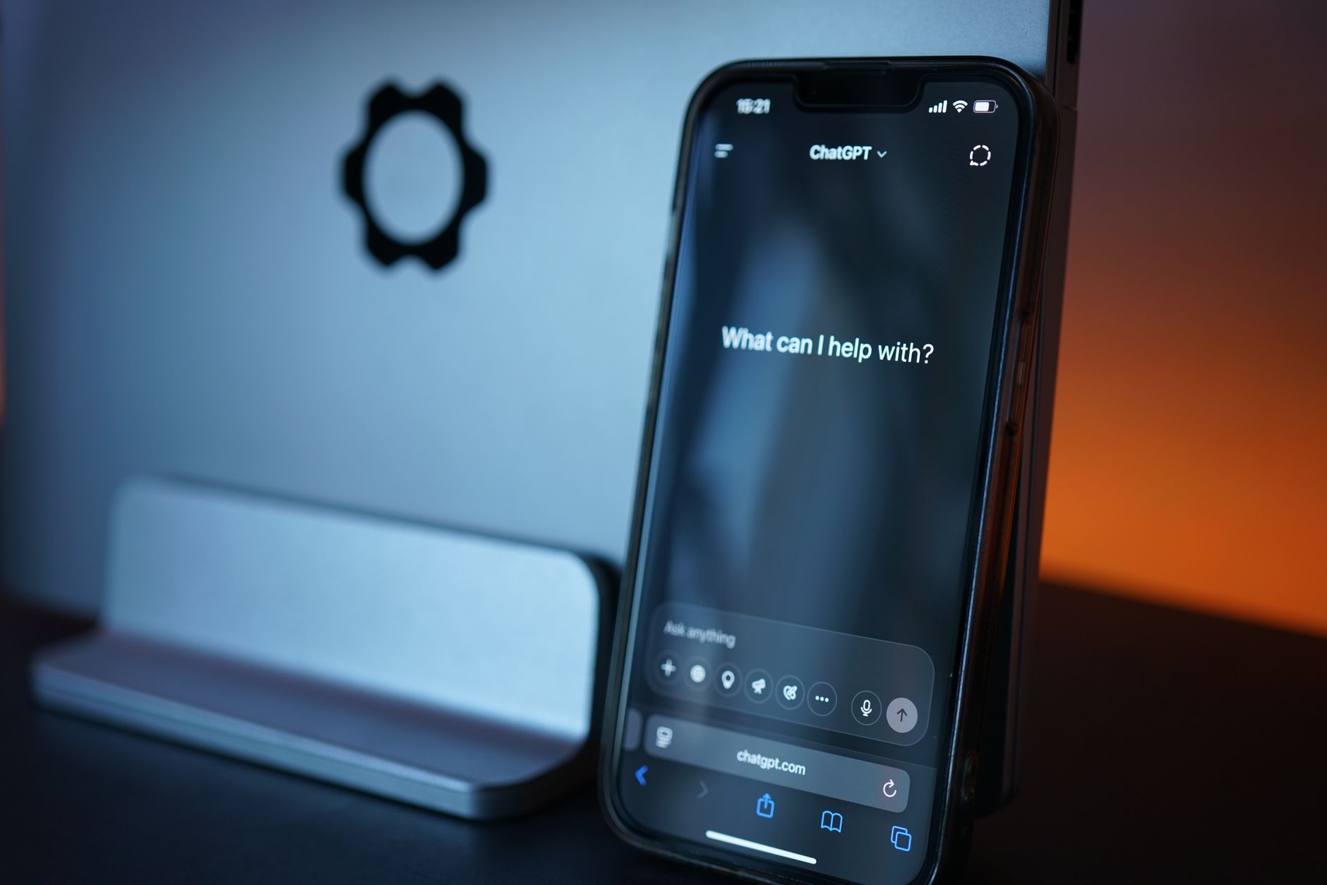 A person typing into an AI chat assistant on a laptop screen