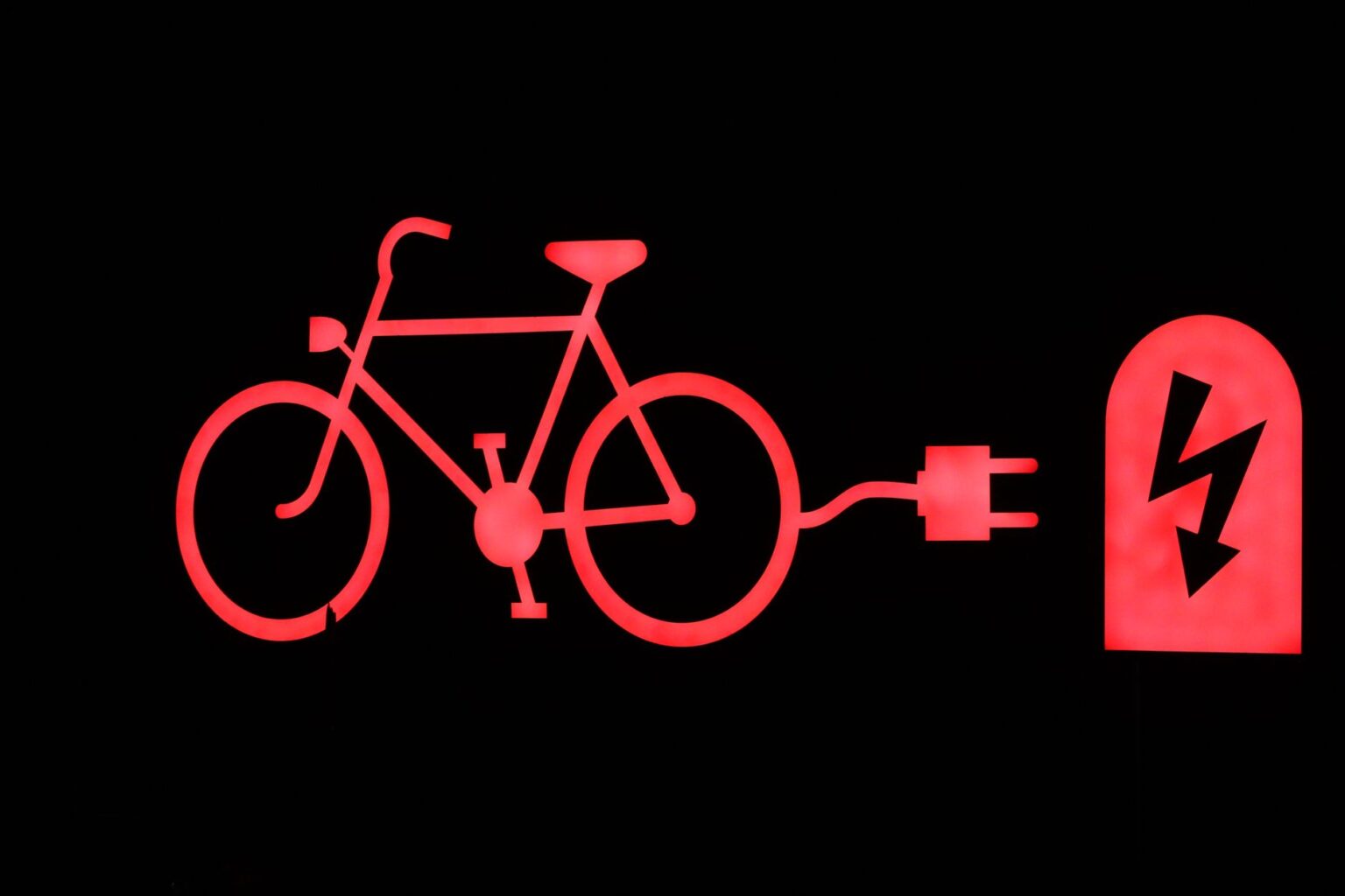A person riding a modern electric bike on a city street