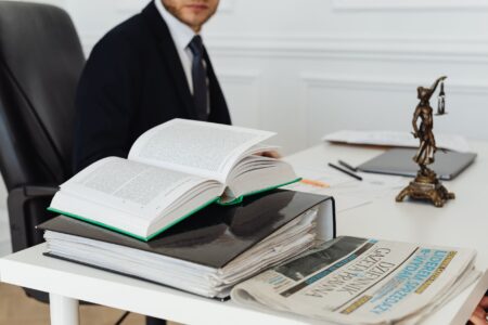 Rippling Fires Back at Runlayer With Its Own Lawsuit Legal documents and a gavel on a desk representing a corporate lawsuit