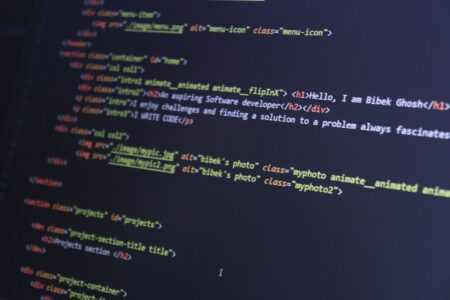 Glowing text on a dark computer screen representing AI-generated content
