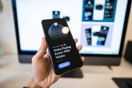 PayPal Sale Talks With Stripe and Advent Gain Momentum Person using smartphone for a digital payment transaction