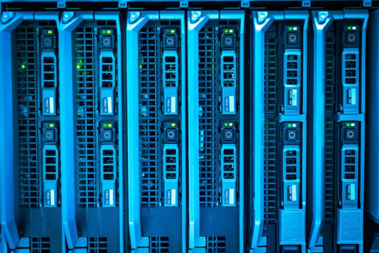 OpenAI and Anthropic Cut Prices as Flock Surveillance Rules Shift Rows of glowing data servers representing AI infrastructure and cloud computing costs