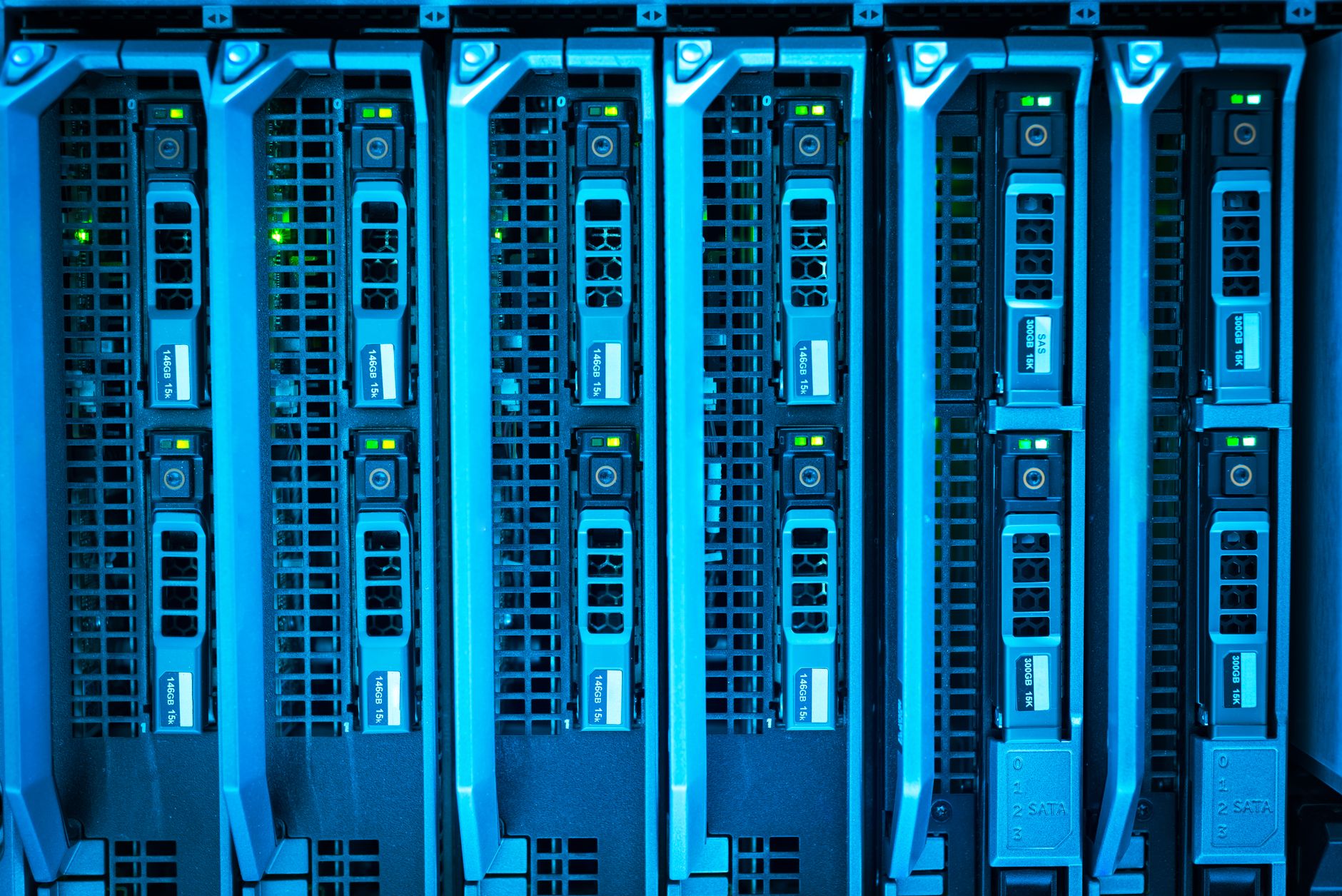 Rows of glowing data servers representing AI infrastructure and cloud computing costs