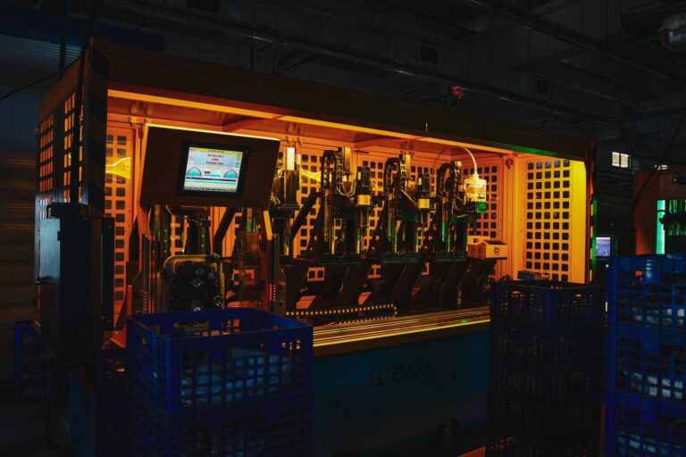 Workers assembling smartphones on a modern electronics manufacturing line