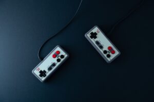 Close-up of a retro gaming controller on a dark surface