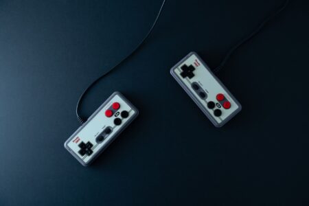 Close-up of a retro gaming controller on a dark surface