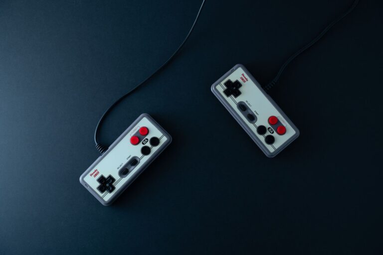 Close-up of a retro gaming controller on a dark surface