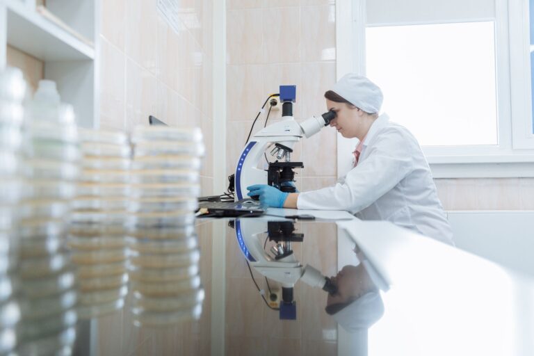 AI Wrote the Drug. Humans Filed the Patent. Researcher working in a pharmaceutical laboratory examining molecular drug candidates