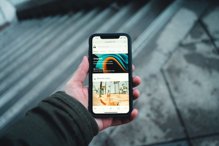 Outernet App Converts Saved Posts Into Actual Outings Person scrolling through saved posts on a smartphone screen