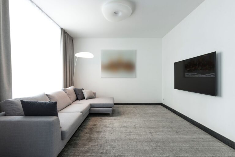 VESA Mounts Explained: What Those Numbers Actually Mean Large flat-screen TV mounted on a white living room wall