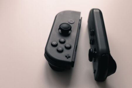 GTA 6 Is Now the Most Expensive Entertainment Product Ever Made A gaming controller resting on a surface, representing the video game industry