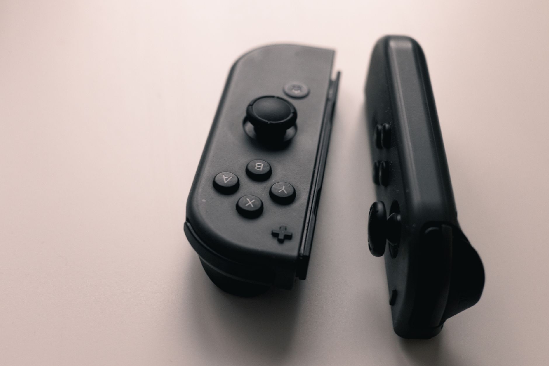 A gaming controller resting on a surface, representing the video game industry