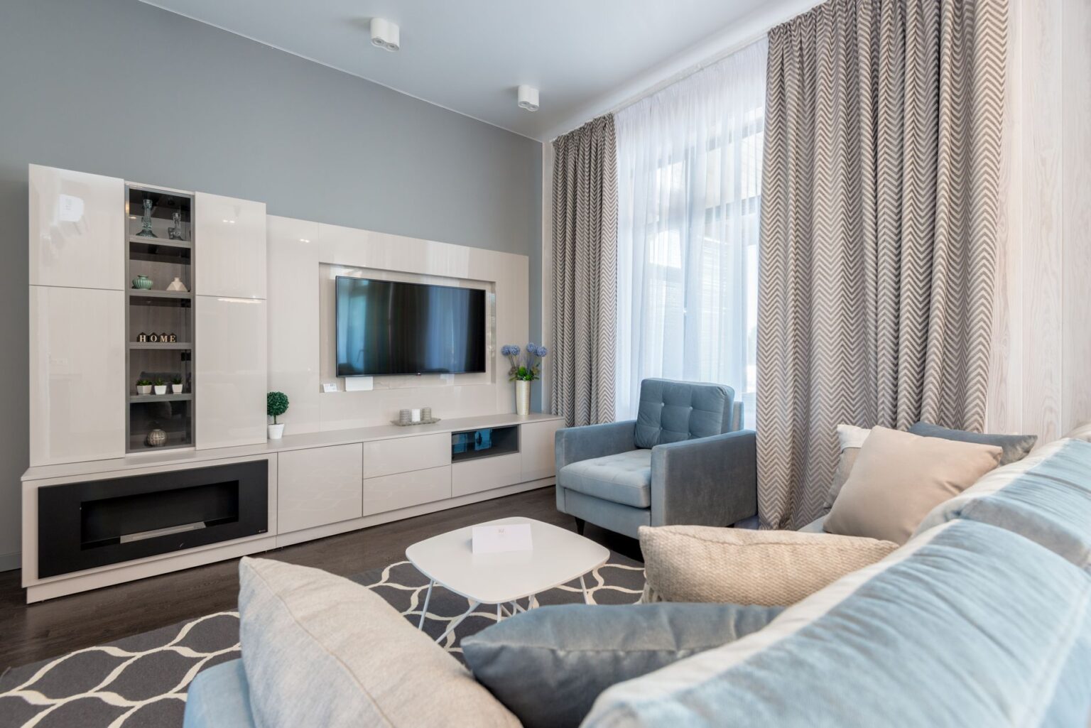 Your 4K TV May Not Be Showing 4K Right Now A modern 4K television mounted in a living room displaying a home screen menu