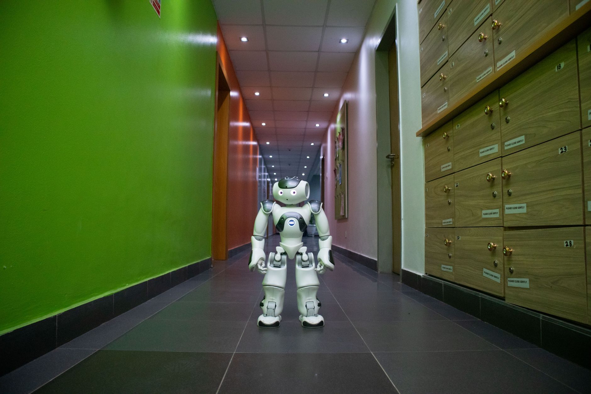 A humanoid robot standing in a research laboratory environment