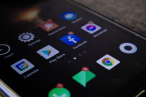 Grindr aims to be the everything app for gay men, but investors are skeptical Person scrolling through a social networking app on a smartphone