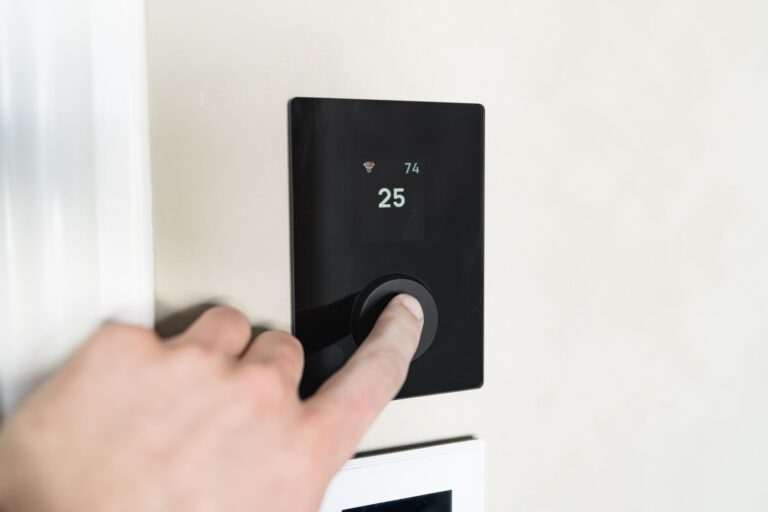 Your Home Devices Are Already Part of the Grid—For a Price Smart thermostat mounted on wall in modern home interior