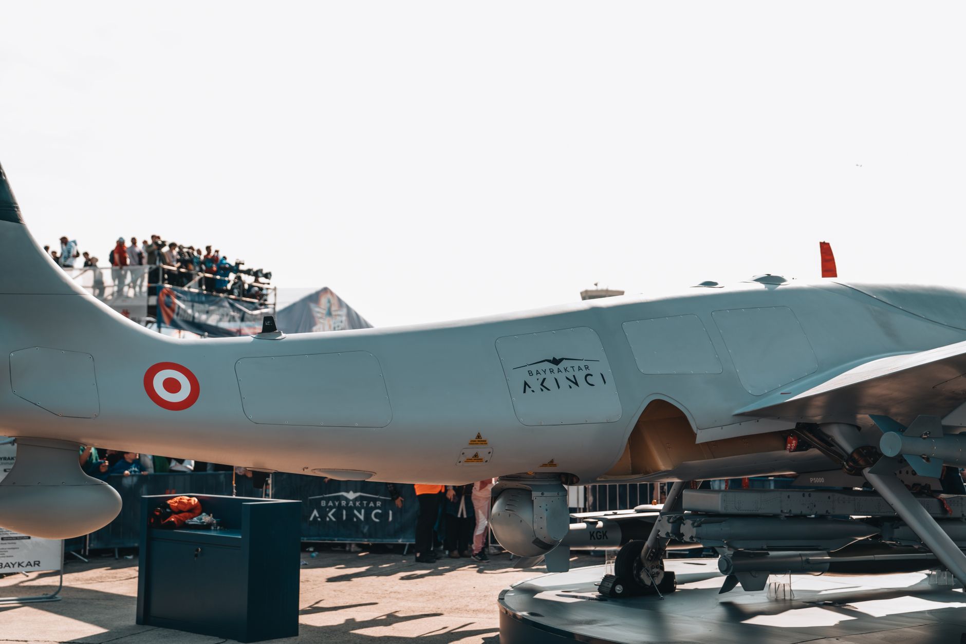 military drone in flight representing drone warfare and GPS jamming risks to civilian airspace