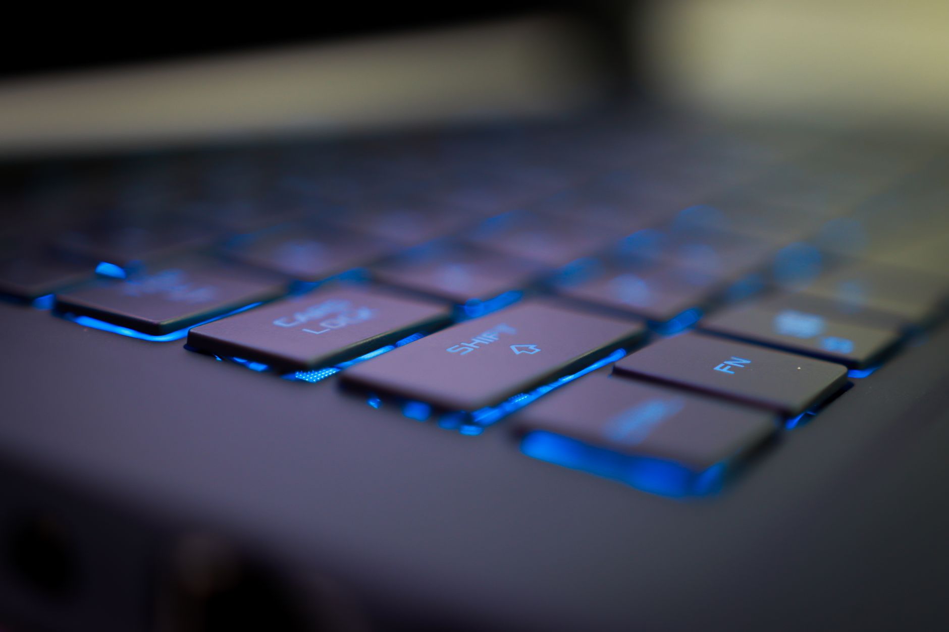 Close-up of a modular laptop keyboard and screen on a desk