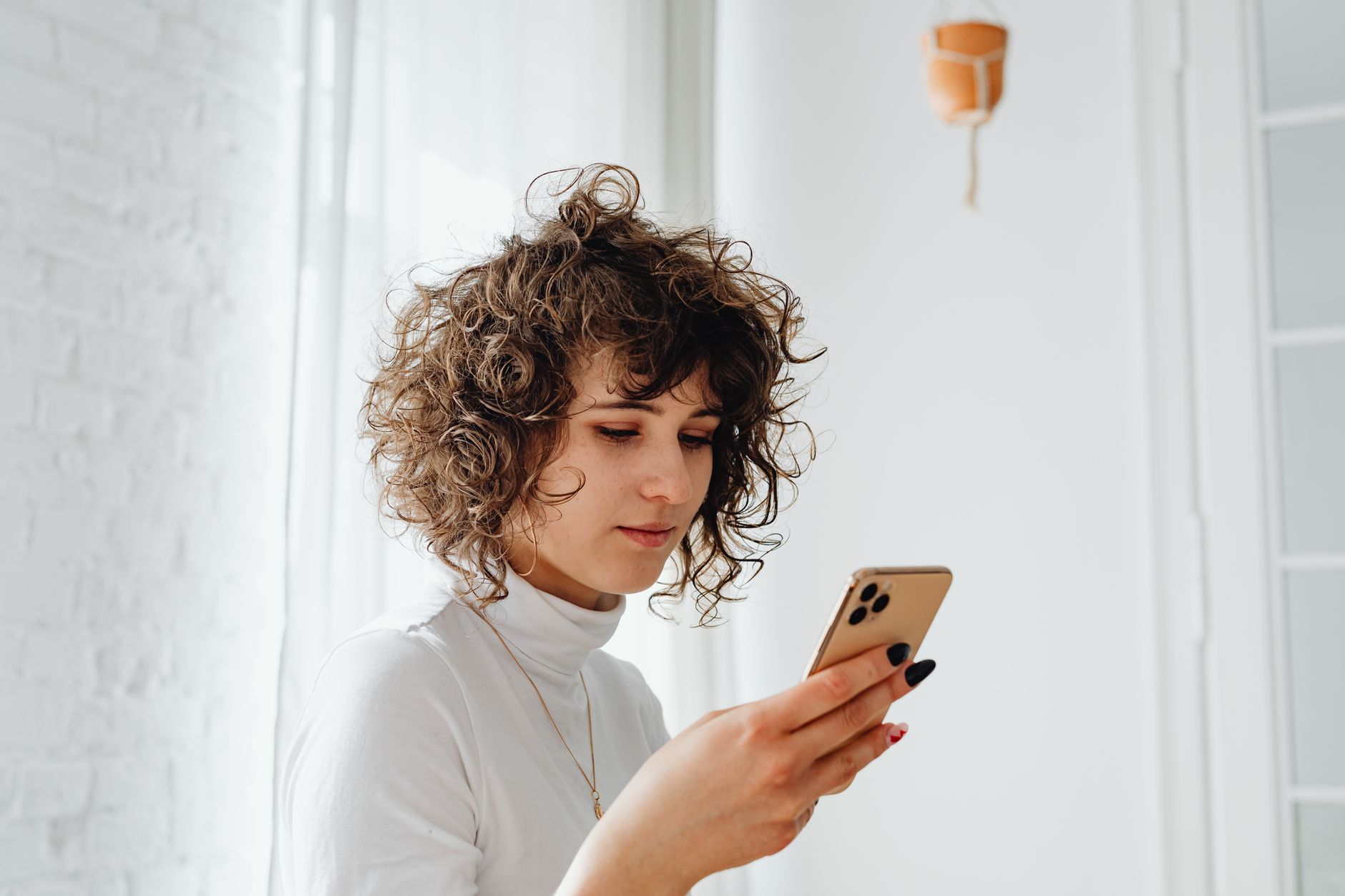 Person scrolling through account settings on a smartphone