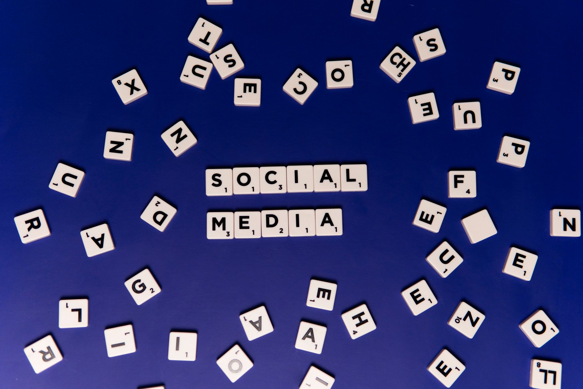 Person scrolling through social media feed representing platform content moderation debates