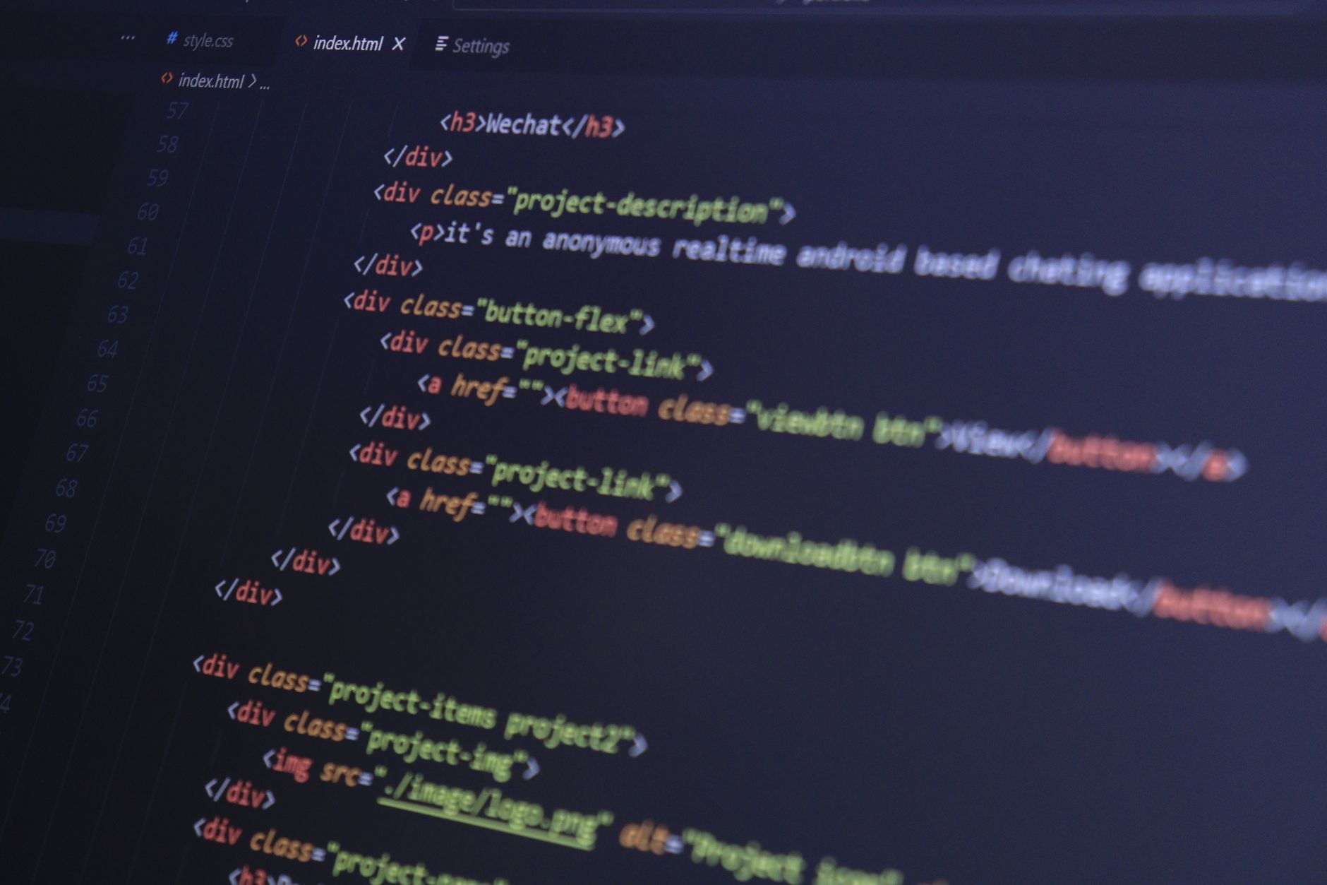 Developer reviewing open source code on a laptop screen