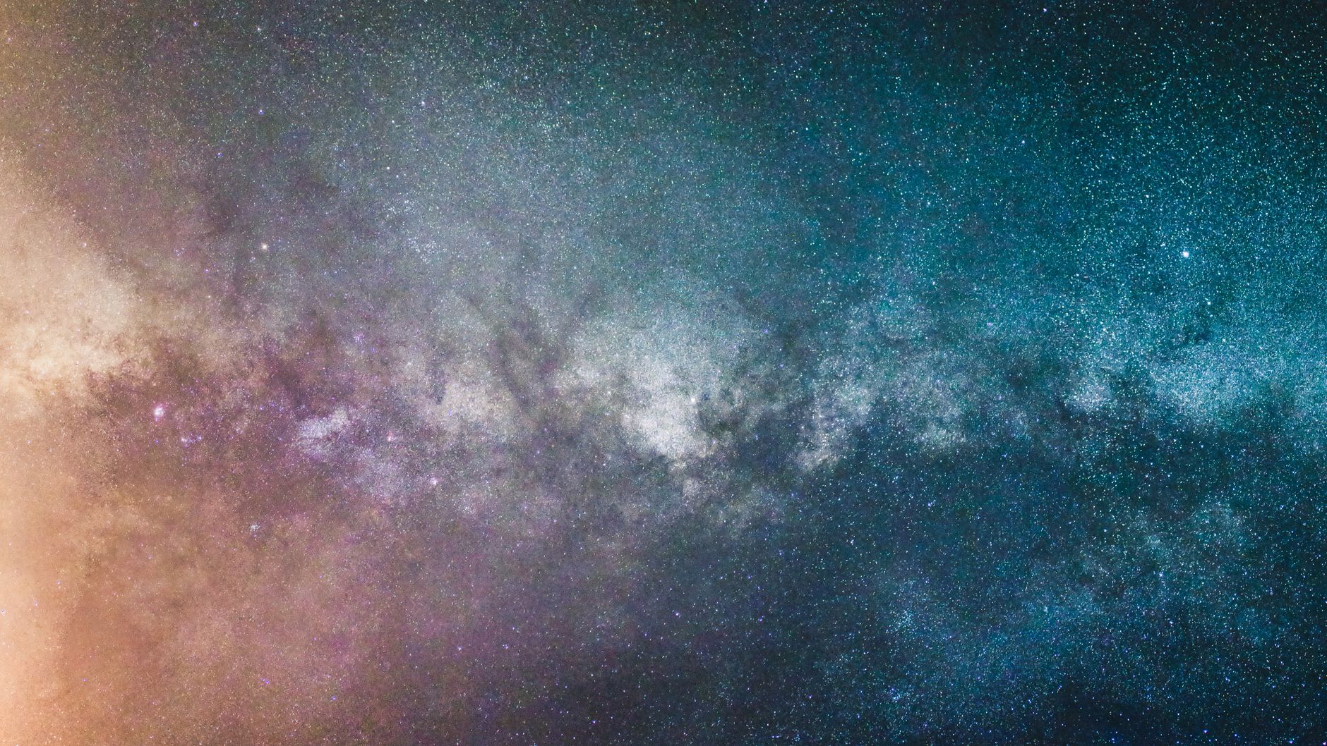 Deep space image showing a bright stellar explosion against distant galaxies