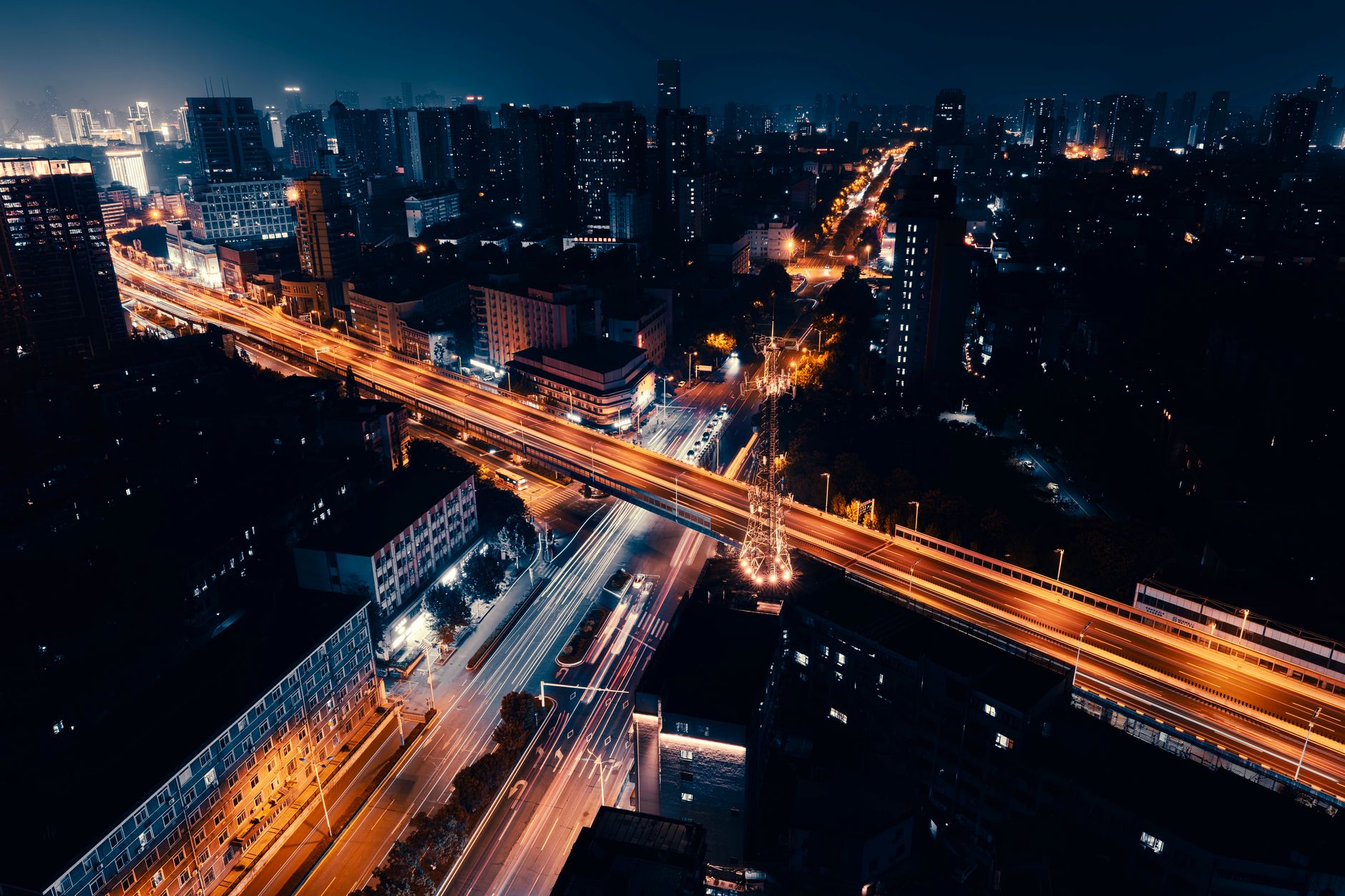 Heavy urban traffic intersection viewed from above showing complex driving environment