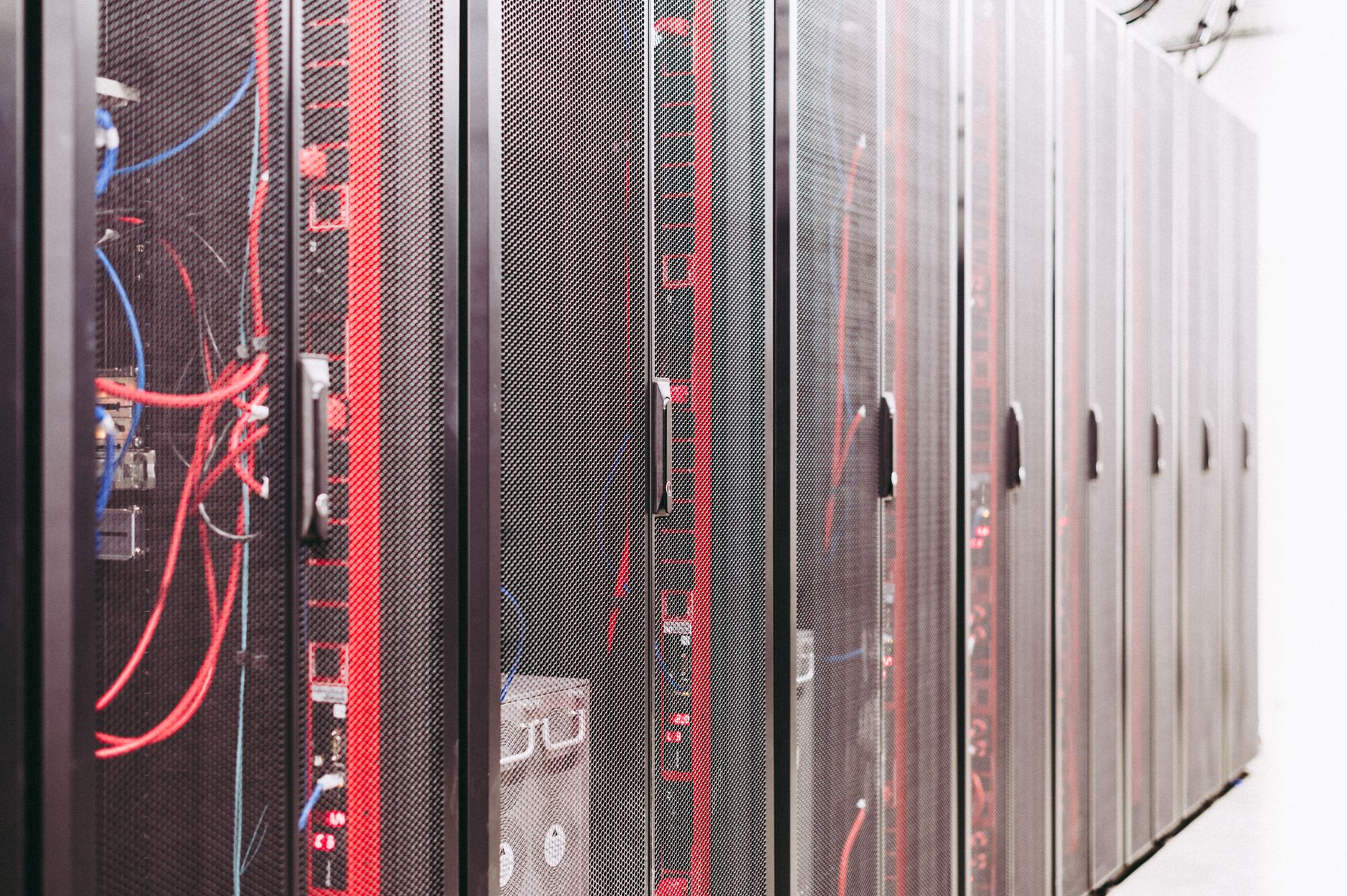 Rows of illuminated servers in a large data center used for AI model training