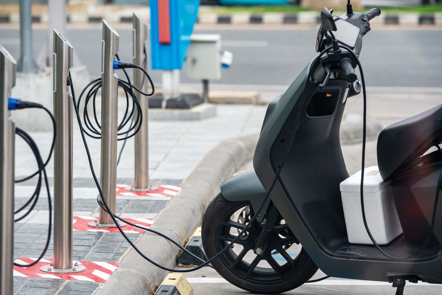 Electric vehicle plugged into home charging station in residential garage