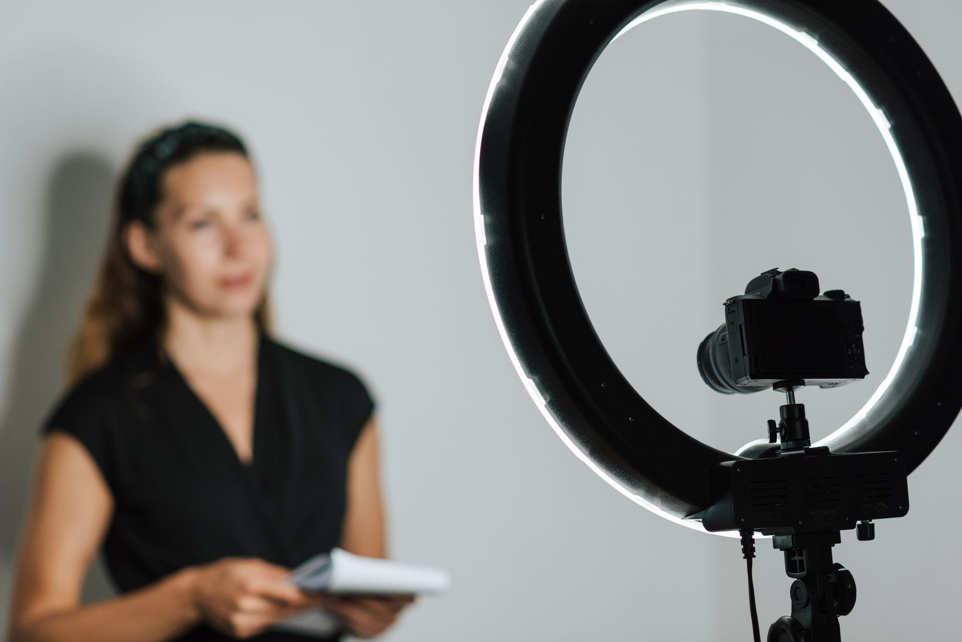 Content creator recording video at a home studio desk