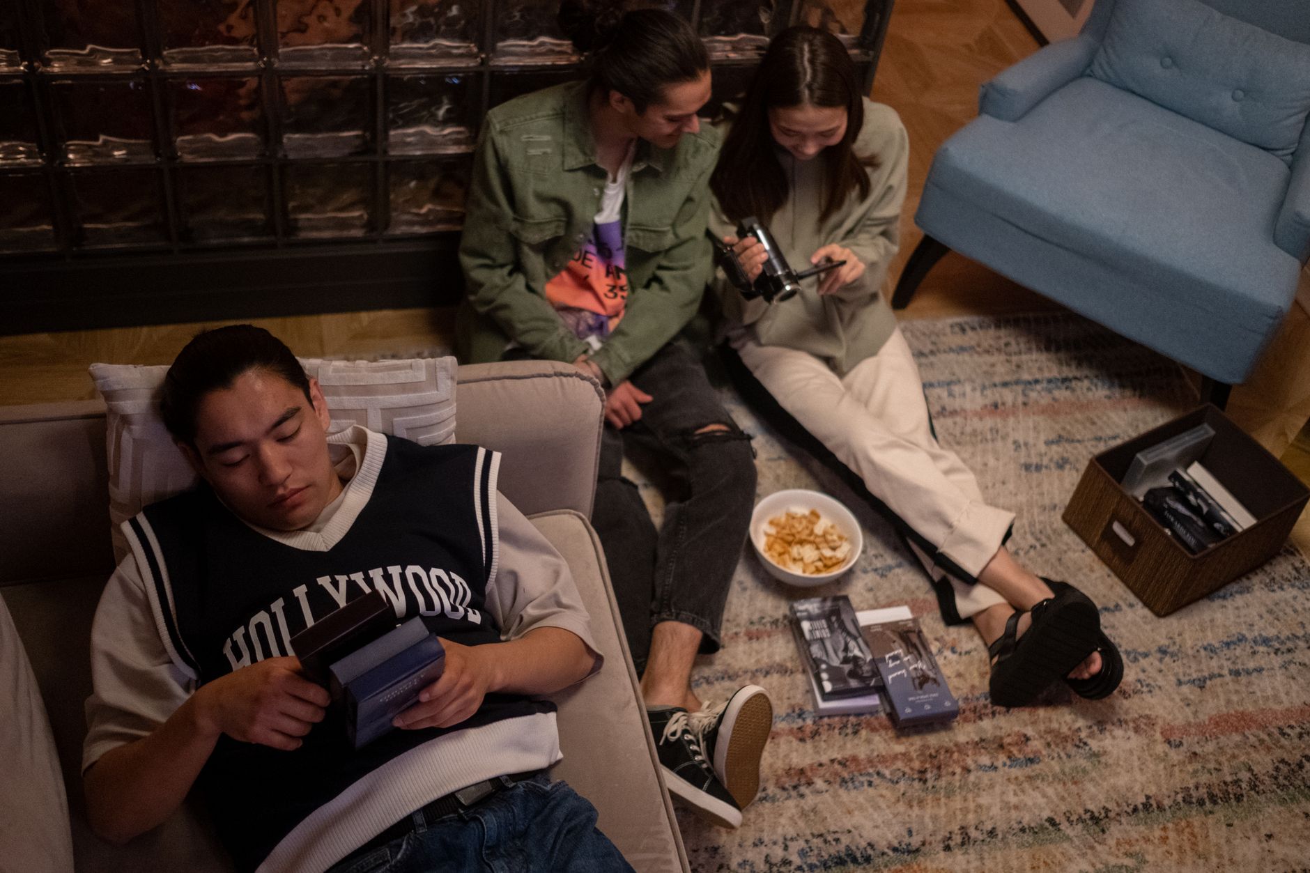 Person watching a film on a large screen in a darkened living room