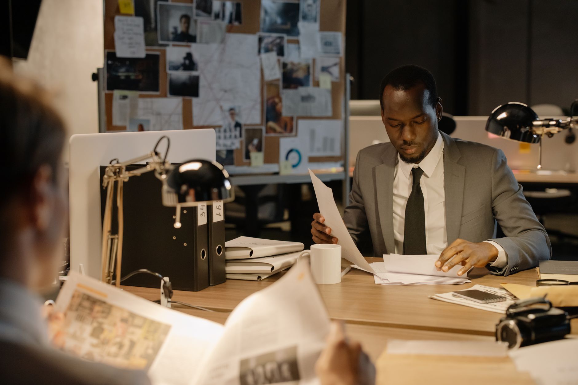 Analyst reviewing data on multiple screens during a cybersecurity investigation