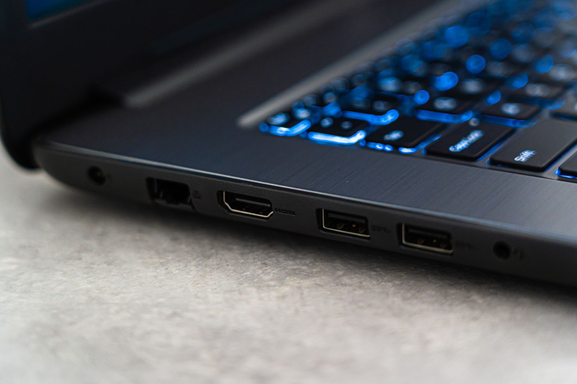 Close-up of HDMI cable being connected to the back of a flat-screen television
