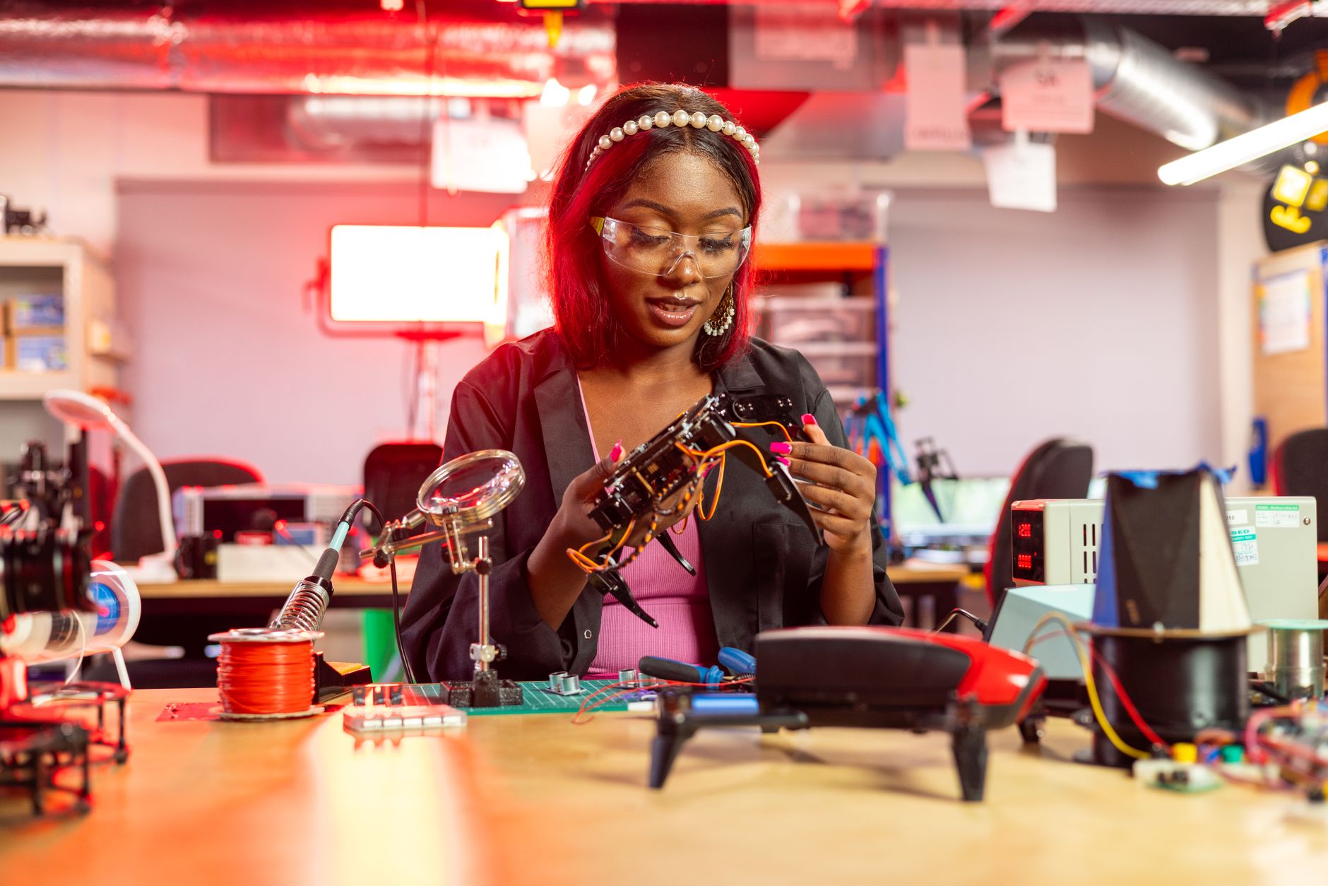 Researchers working with robotic systems in a university lab setting