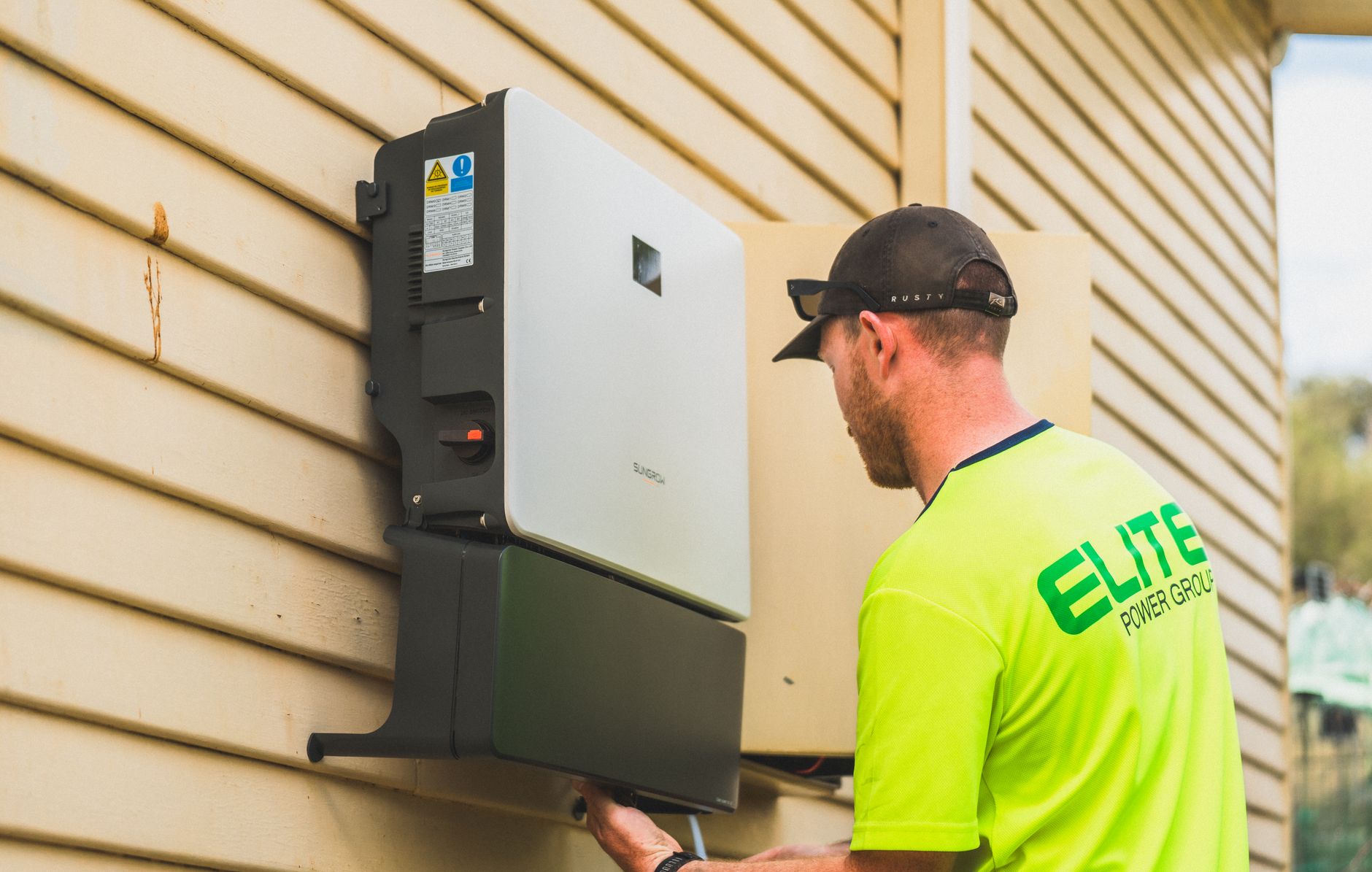 Residential solar panels and home battery storage system on house exterior
