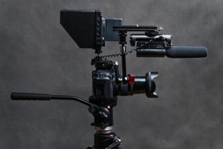 Large professional film camera on a movie set with crew nearby