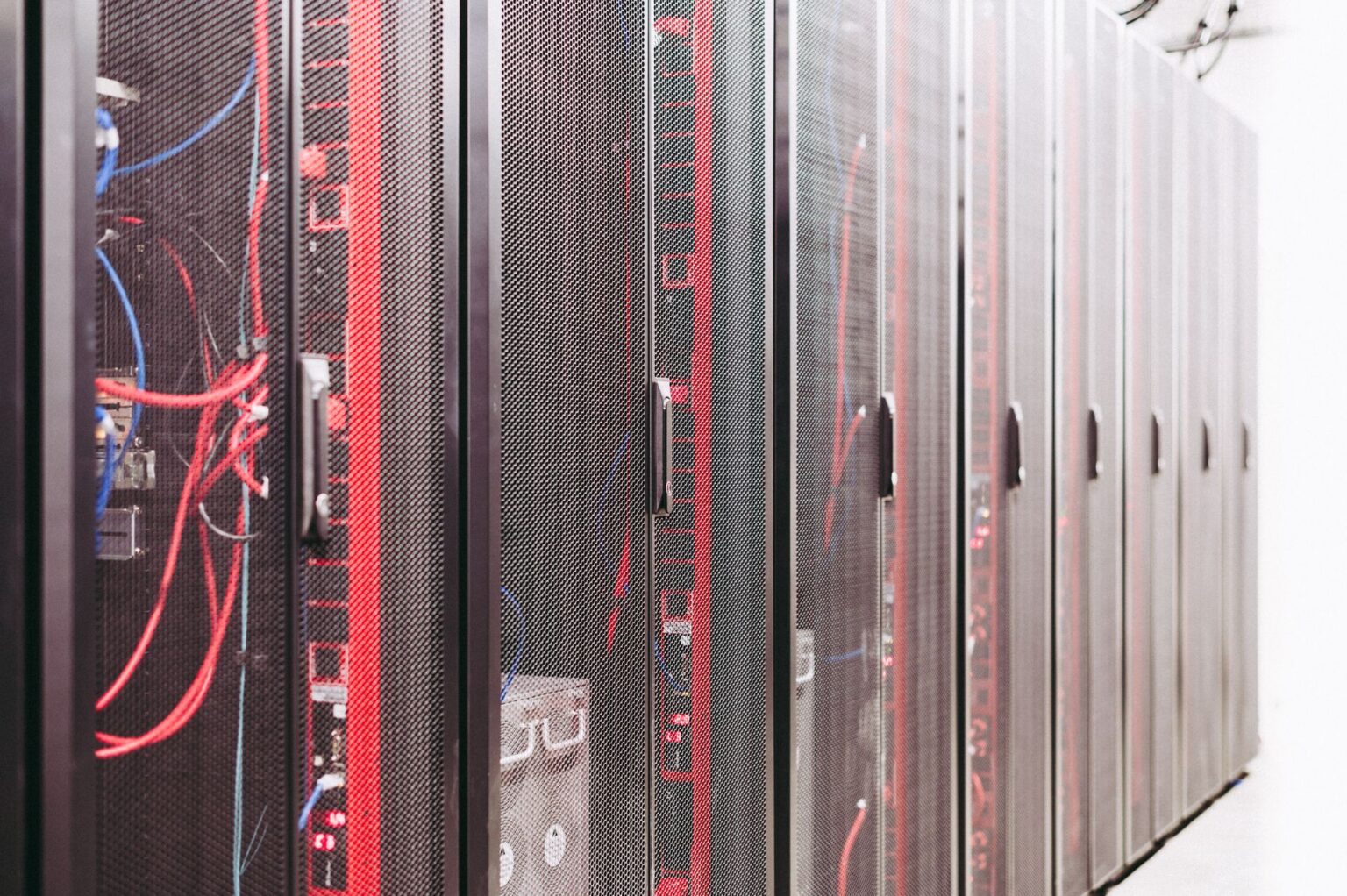 Cornelis Networks Raises $205M, Targets GPU Idle Time Problem Rows of servers inside a large AI data center facility