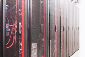 Cornelis Networks Raises $205M, Targets GPU Idle Time Problem Rows of servers inside a large AI data center facility