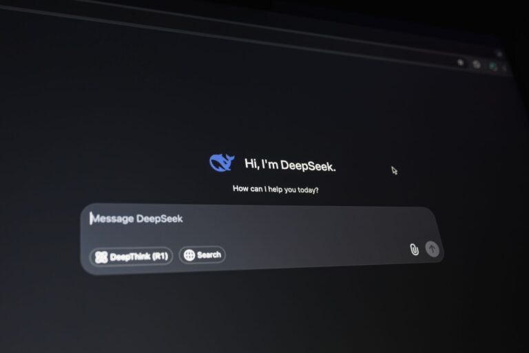 Claude Gets Document Creation and Cowork Tools for Paid Users Person using an AI chat interface on a laptop to create documents