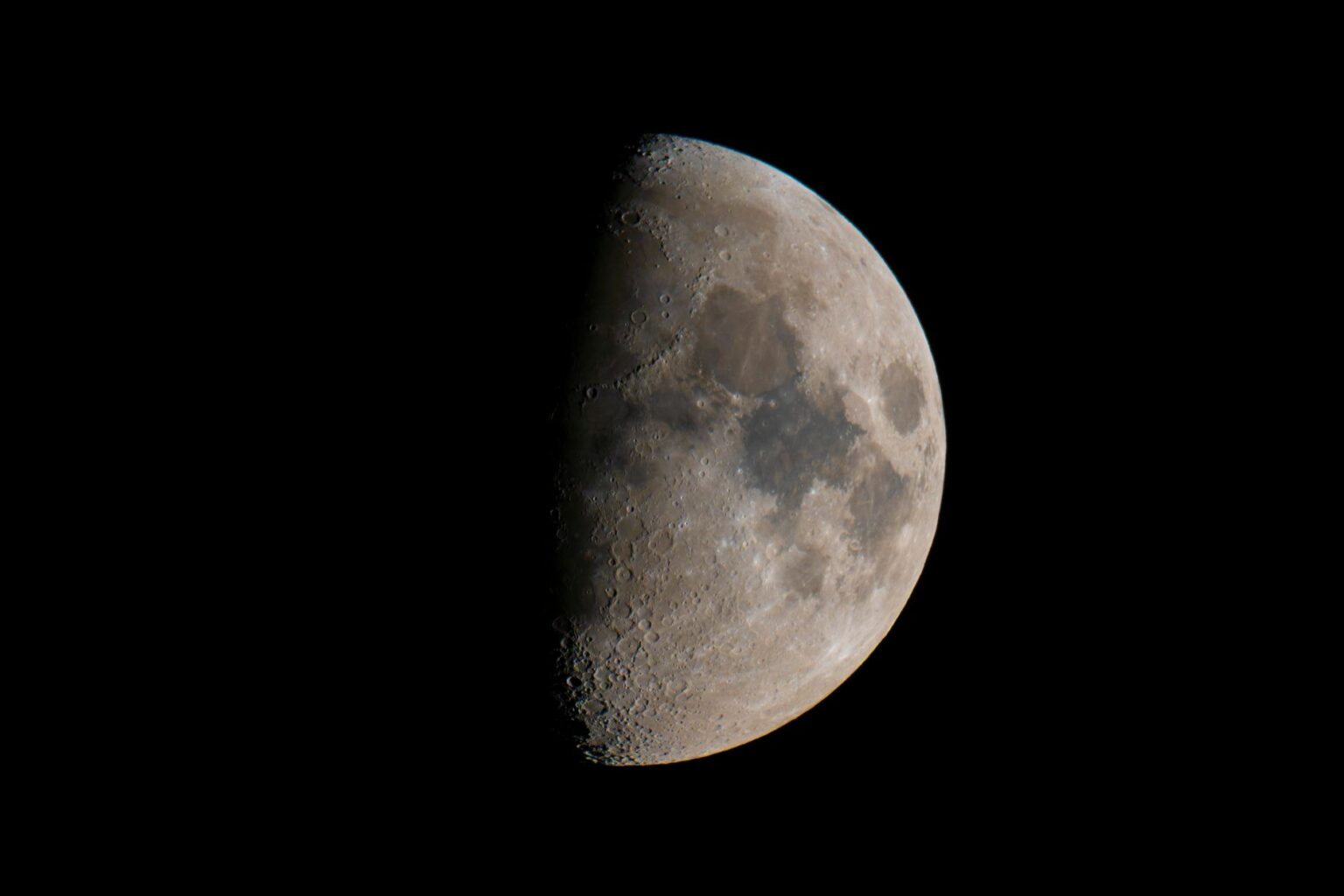 NASA Orbiter Photographs a Moon Crater That Forms Once Per Century Close-up view of the moon's cratered surface under stark lighting