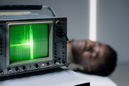 The Download: the Pentagon’s AI-powered lie detector and young organ limits Vintage polygraph machine with paper readout representing AI-powered lie detection technology