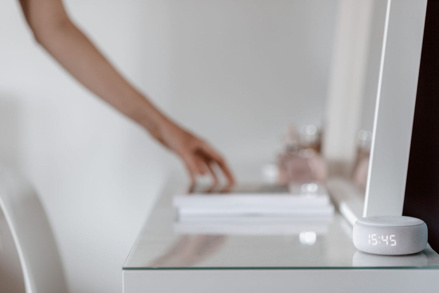 Ugreen’s new smart home ecosystem is built around local AI hubs A modern smart home hub device sitting on a desk in a living room