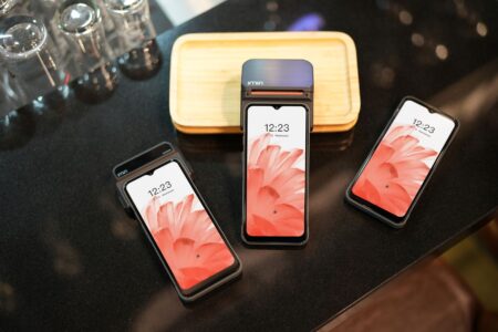 Foldable Phones Keep Getting Better, Except for One Thing A foldable smartphone open at a partial angle on a flat surface
