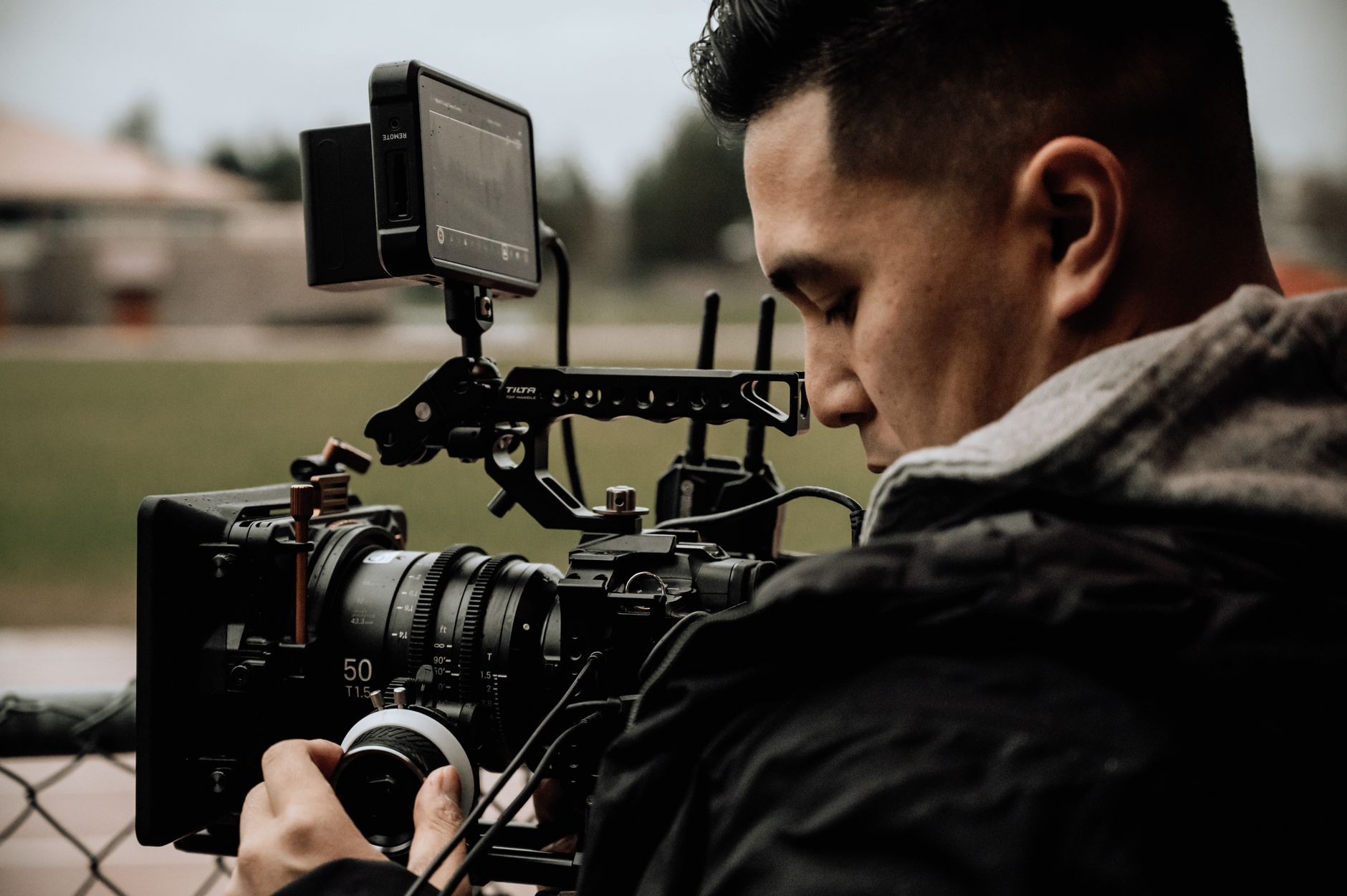 Filmmaker operating a camera during a documentary production