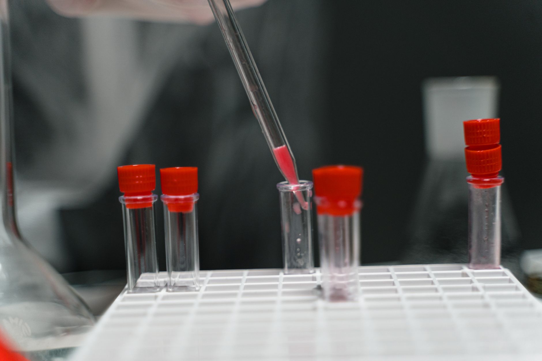 Scientist in a laboratory examining samples during pharmaceutical drug research and clinical trials
