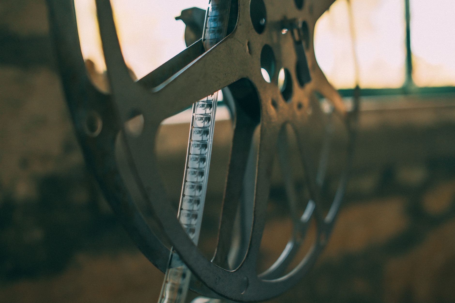 Close-up of a wide film strip showing perforations along the edge