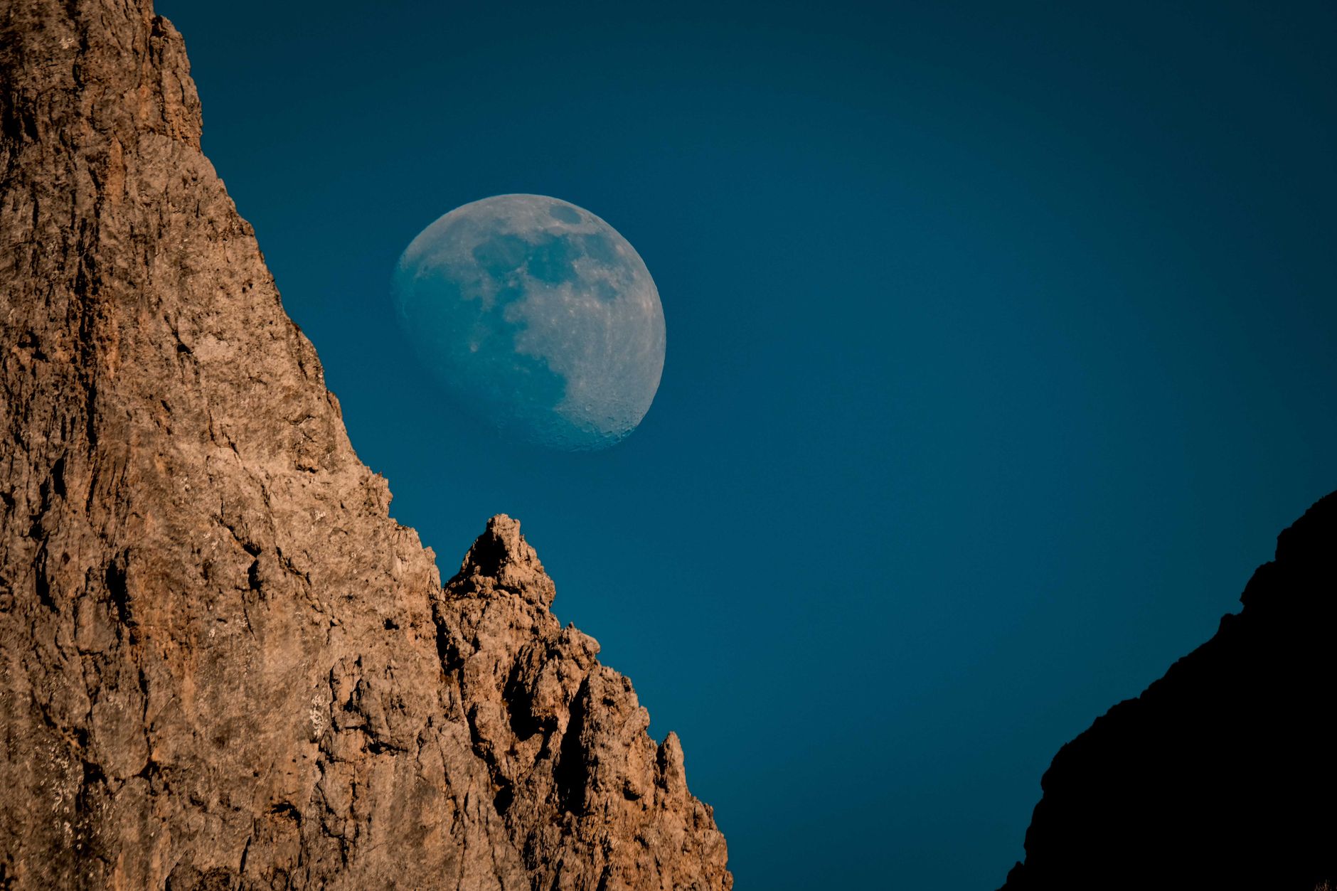 Wide lunar terrain showing rocky surface features and craters