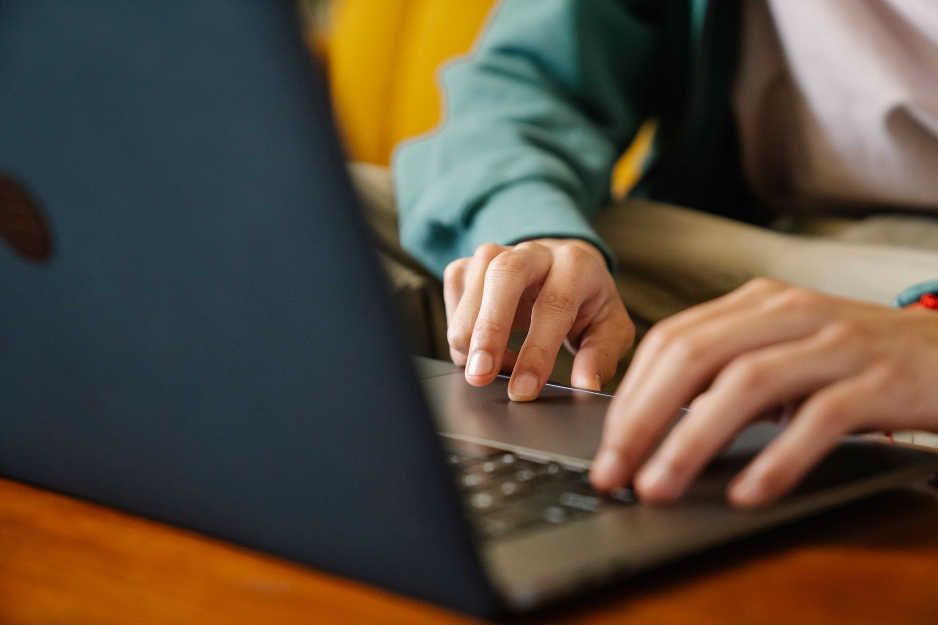 Person filling out an online form on a laptop, representing the claim submission process