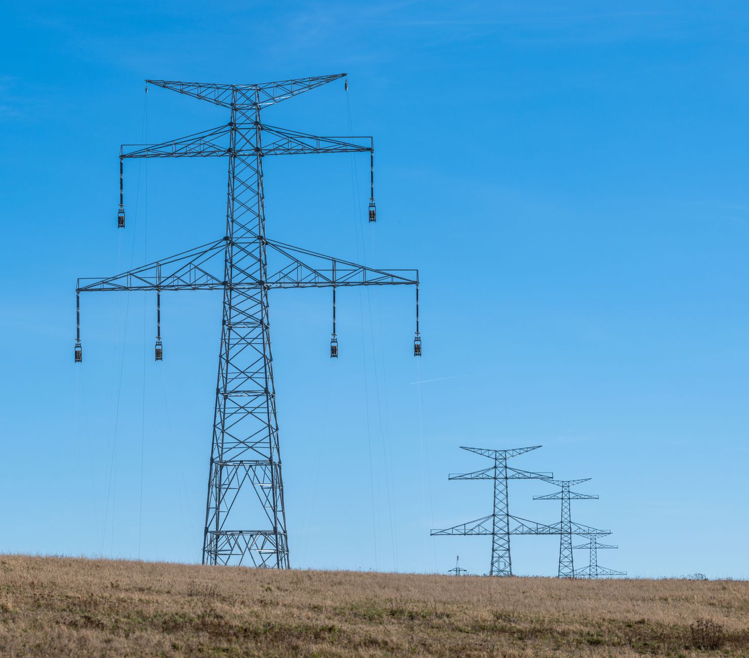 High-voltage power lines and electrical infrastructure in a rural area